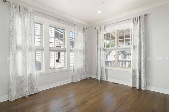 168 Brighton Blvd, Woodstock, GA 30188 - empty room with wood finished floors, ornamental molding, baseboards, and recessed lighting