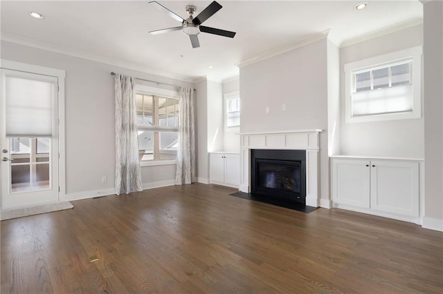 168 Brighton Blvd, Woodstock, GA 30188 - unfurnished living room with ornamental molding, ceiling fan, wood finished floors, a fireplace with flush hearth, and baseboards