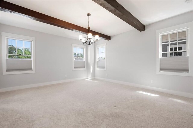 168 Brighton Blvd, Woodstock, GA 30188 - spare room with a chandelier, plenty of natural light, carpet floors, baseboards, and beam ceiling