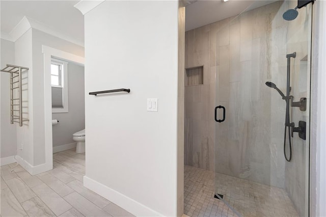 168 Brighton Blvd, Woodstock, GA 30188 - full bathroom featuring toilet, a stall shower, crown molding, and baseboards