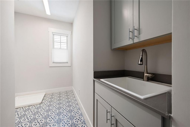 168 Brighton Blvd, Woodstock, GA 30188 - laundry area featuring a sink and baseboards