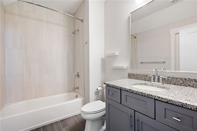 168 Brighton Blvd, Woodstock, GA 30188 - full bath featuring vanity, toilet, washtub / shower combination, and wood finished floors