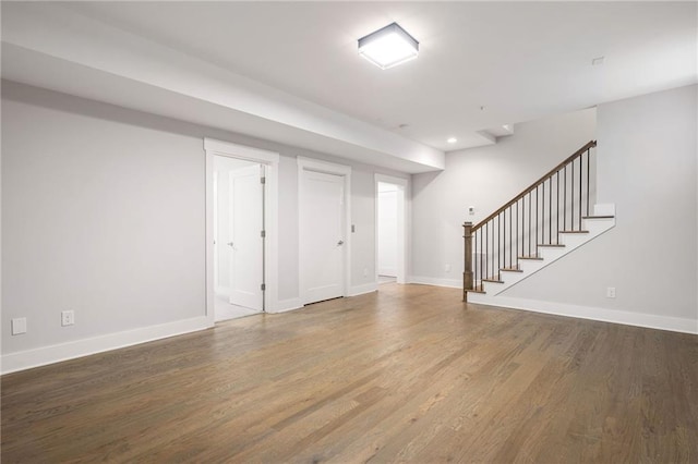 168 Brighton Blvd, Woodstock, GA 30188 - finished basement featuring stairs, wood finished floors, baseboards, and recessed lighting