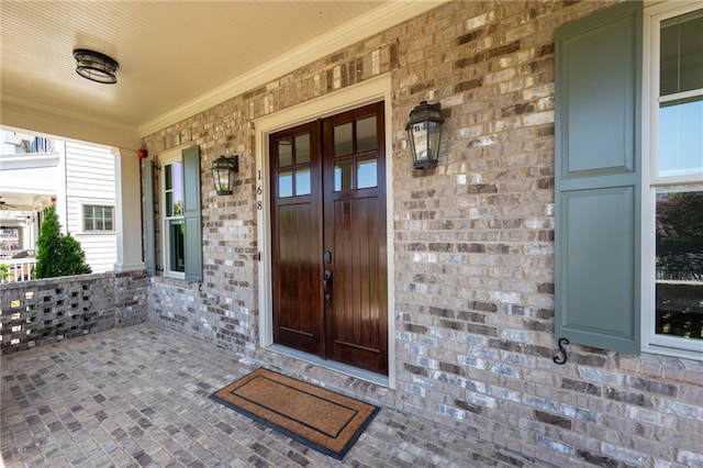 168 Brighton Blvd, Woodstock, GA 30188 - view of exterior entry featuring covered porch, brick siding, and french doors