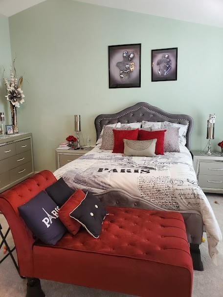 carpeted bedroom featuring vaulted ceiling