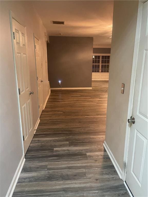 2118 Burns View Ln, Lawrenceville, GA 30044 - hall featuring dark wood-type flooring and baseboards