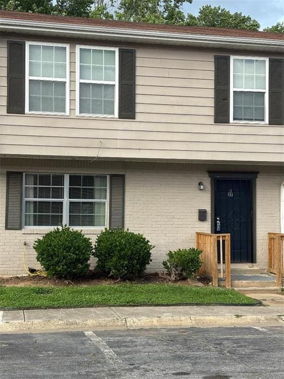 4701 Flat Shoals Rd Unit 37E, Union City, GA 30291 - view of property featuring brick siding and uncovered parking