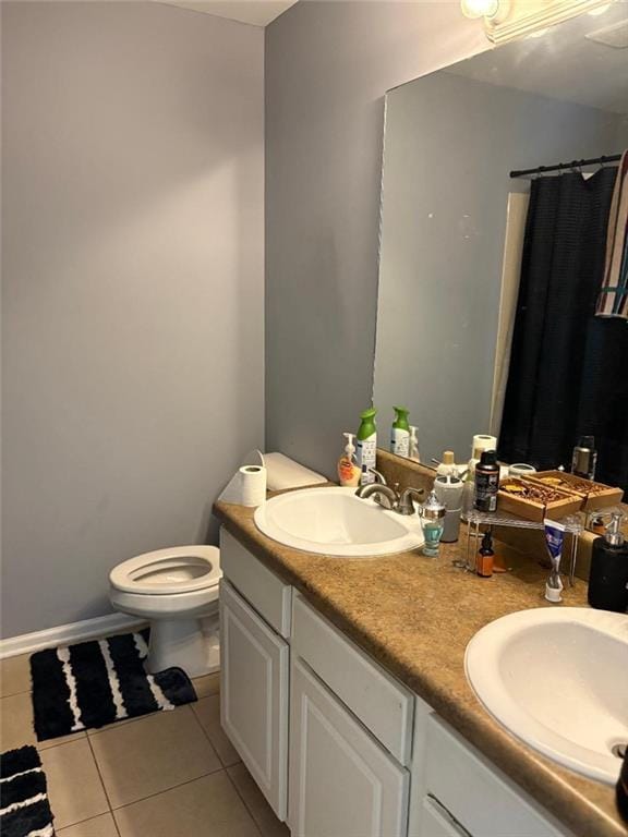 4701 Flat Shoals Rd Unit 37E, Union City, GA 30291 - bathroom featuring tile patterned floors, toilet, double vanity, and a shower with curtain