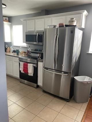 4701 Flat Shoals Rd Unit 37E, Union City, GA 30291 - kitchen featuring appliances with stainless steel finishes, plenty of natural light, and white cabinets