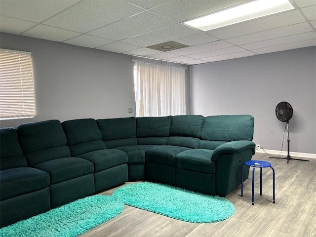 4701 Flat Shoals Rd Unit 37E, Union City, GA 30291 - living room featuring light wood-style floors, a drop ceiling, and baseboards