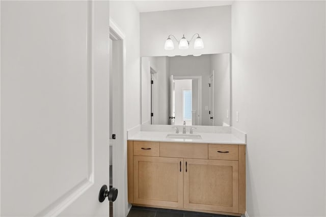 bathroom with tile patterned flooring and vanity