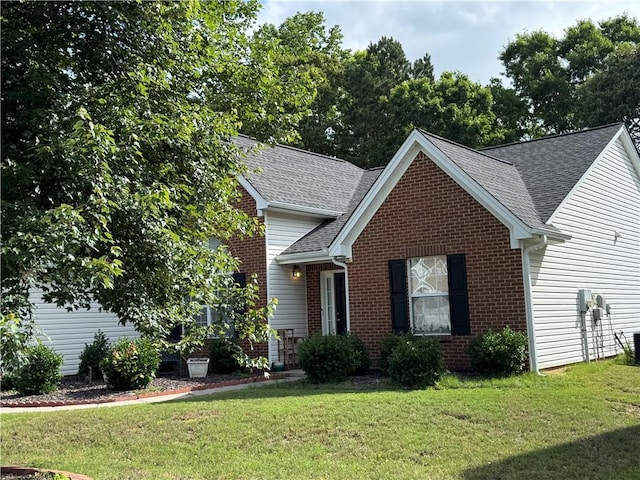 3690 Crescent Walk Ln, Suwanee, GA 30024 - traditional home with brick siding, a front yard, a shingled roof, and cooling unit