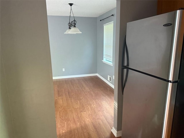 109 Westwood Dr, Dallas, GA 30132 - unfurnished dining area featuring wood finished floors and a textured ceiling