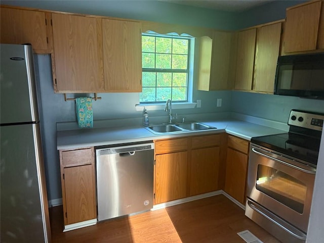109 Westwood Dr, Dallas, GA 30132 - kitchen with stainless steel appliances, dark wood finished floors, and light countertops