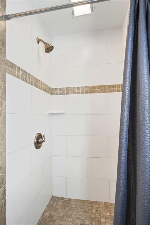 bathroom with curtained shower