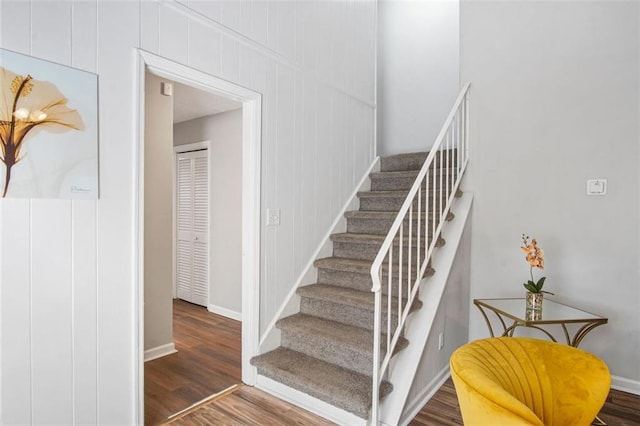 stairway featuring wood-type flooring