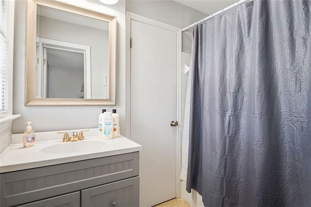 bathroom with vanity and walk in shower