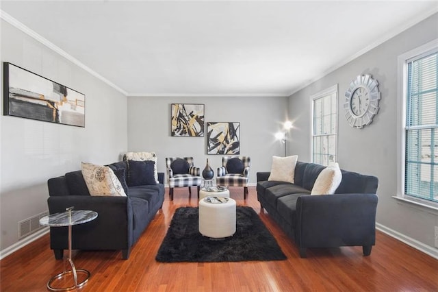 living room featuring crown molding and hardwood / wood-style floors