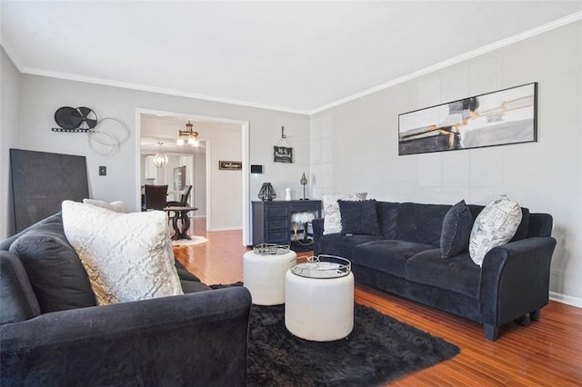 living room featuring hardwood / wood-style flooring and ornamental molding