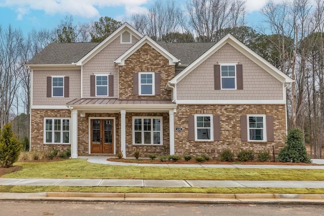 3390 Hillshire Dr, Cumming, GA 30028 - craftsman-style home featuring brick siding, a front lawn, french doors, and roof with shingles