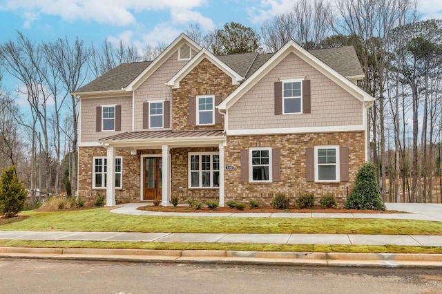 3390 Hillshire Dr, Cumming, GA 30028 - craftsman-style house featuring a front lawn, brick siding, and a shingled roof