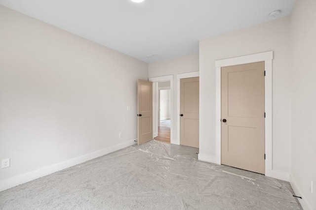 3390 Hillshire Dr, Cumming, GA 30028 - unfurnished bedroom with baseboards and light colored carpet