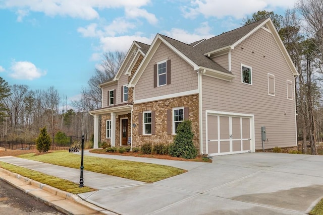 3390 Hillshire Dr, Cumming, GA 30028 - craftsman inspired home with driveway, a front yard, an attached garage, stone siding, and roof with shingles