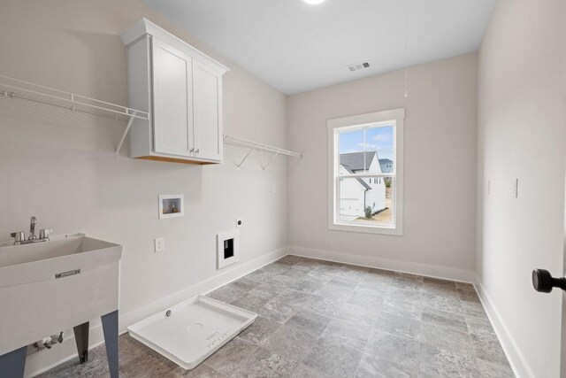 3390 Hillshire Dr, Cumming, GA 30028 - laundry room with cabinet space, hookup for a washing machine, baseboards, and light stone finish flooring