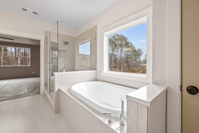 3390 Hillshire Dr, Cumming, GA 30028 - bathroom with a bath, a shower stall, and tile patterned floors