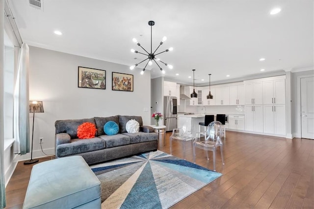 6890 Peachtree Dunwoody Rd Unit 303, Atlanta, GA 30328 - living area with a chandelier, recessed lighting, baseboards, dark wood-style flooring, and crown molding