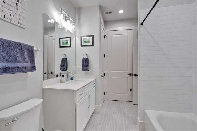 6890 Peachtree Dunwoody Rd Unit 303, Atlanta, GA 30328 - bathroom featuring toilet, vanity, shower / bath combination, and recessed lighting