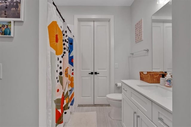 6890 Peachtree Dunwoody Rd Unit 303, Atlanta, GA 30328 - bathroom featuring toilet, vanity, and a shower with curtain