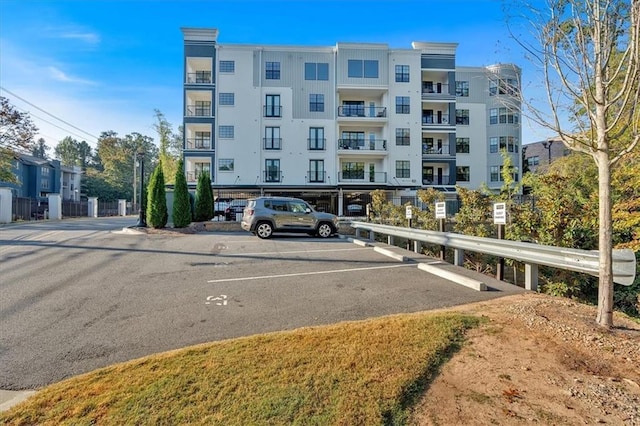 6890 Peachtree Dunwoody Rd Unit 303, Atlanta, GA 30328 - view of property with uncovered parking
