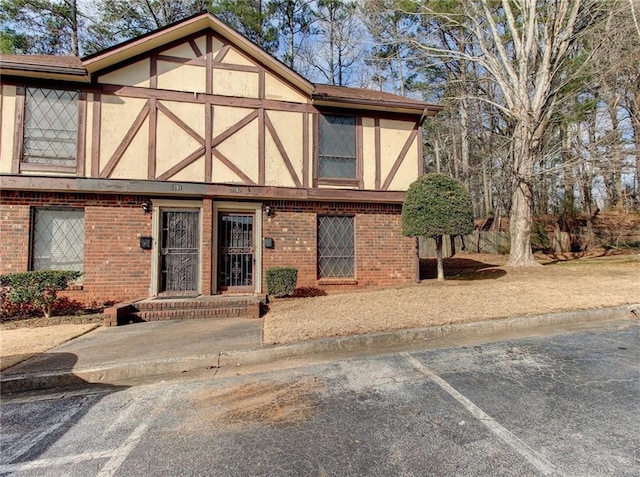 3252 Abbeywood Dr, Decatur, GA 30034 - tudor house with stucco siding and brick siding