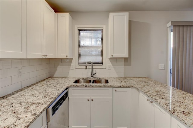 3252 Abbeywood Dr, Decatur, GA 30034 - kitchen featuring a sink, stainless steel dishwasher, white cabinetry, tasteful backsplash, and light stone counters