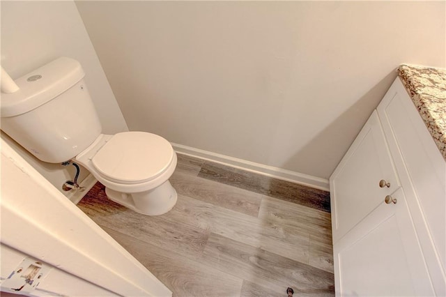 3252 Abbeywood Dr, Decatur, GA 30034 - bathroom with toilet, baseboards, and wood finished floors
