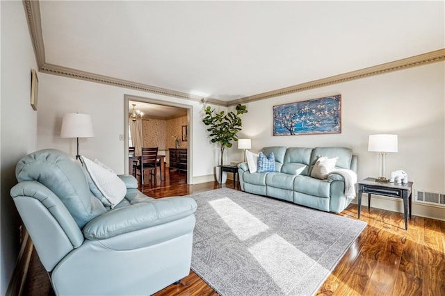 living room featuring hardwood / wood-style floors and ornamental molding