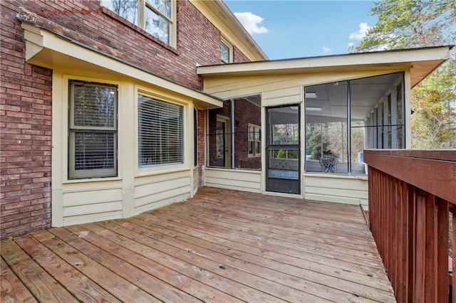 wooden terrace featuring a sunroom