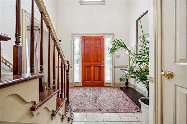 foyer entrance featuring light tile patterned flooring