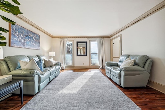 living room featuring dark hardwood / wood-style floors and crown molding