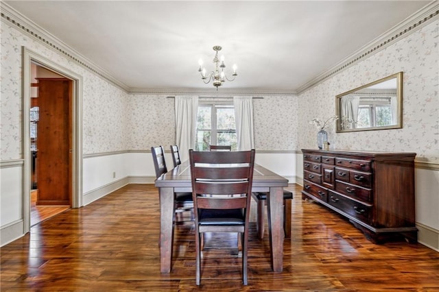 dining space featuring a chandelier, dark wood-type flooring, and ornamental molding