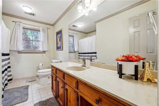 bathroom with tile patterned floors, vanity, toilet, and crown molding