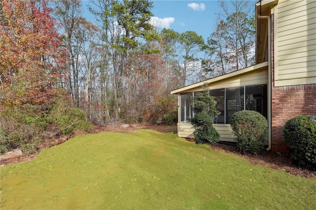 view of yard with a sunroom