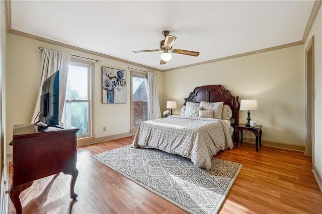 bedroom featuring ceiling fan, light hardwood / wood-style floors, and ornamental molding