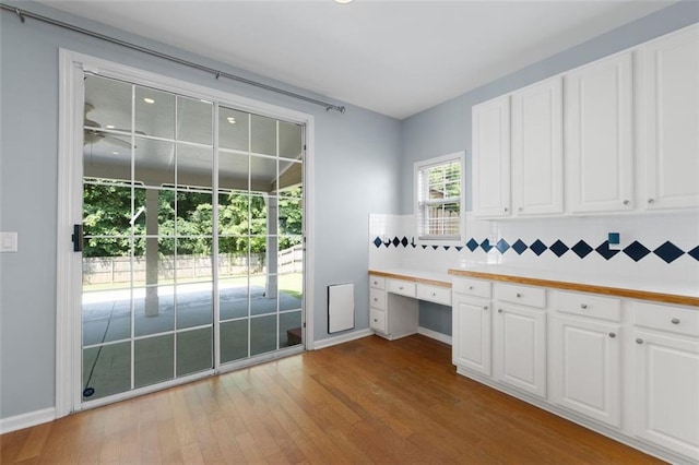 3362 Palm Cir NW, Kennesaw, GA 30144 - unfurnished office with built in desk, wood finished floors, and baseboards