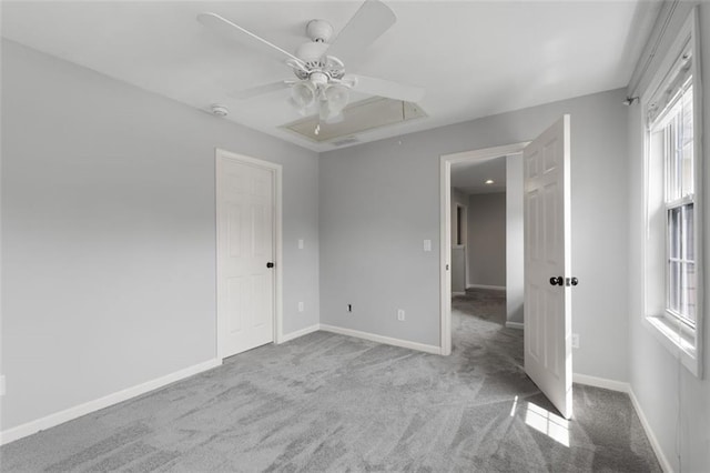 3362 Palm Cir NW, Kennesaw, GA 30144 - spare room with attic access, carpet floors, healthy amount of natural light, and a ceiling fan