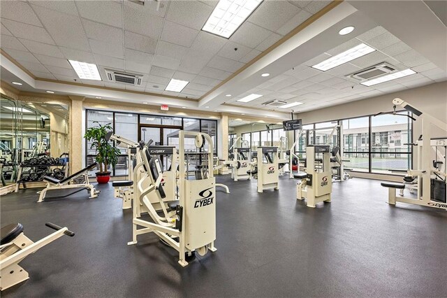 exercise room with a paneled ceiling