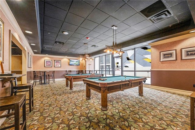 game room featuring a tray ceiling, carpet flooring, a paneled ceiling, billiards, and crown molding