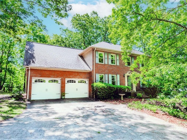 1463 Shadowrock Hts, Marietta, GA 30062 - colonial house featuring a garage, asphalt driveway, brick siding, and roof with shingles