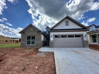 5444 Miravista Way, Hoschton, GA 30548 - view of front of home featuring an attached garage, driveway, and stone siding